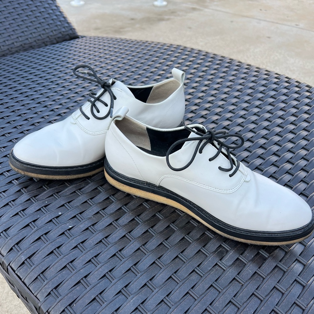 Clark’s Originals white and black lace up shoes.